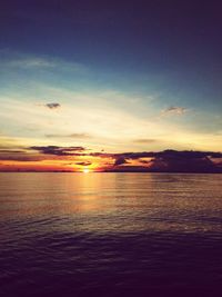 Scenic view of sea against sky at sunset