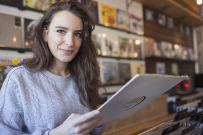Young woman in a record store.
