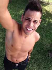 Portrait of smiling young man standing outdoors