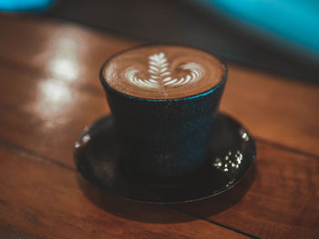 Close-up of coffee cup on table