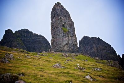 Rock formations on landscape against sky