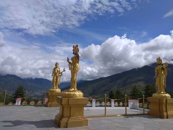 Statue of buddha against sky