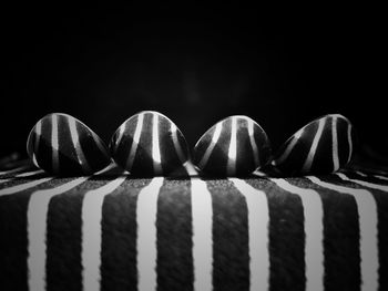 Close-up of spoons on fabric against black background