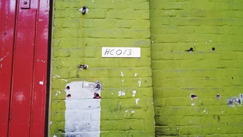 Message on green wall of abandoned building