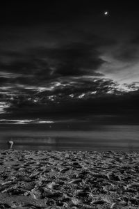 Scenic view of sea against storm clouds