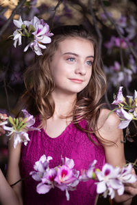 Portrait of woman with pink flowers