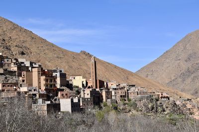 Buildings in city against sky