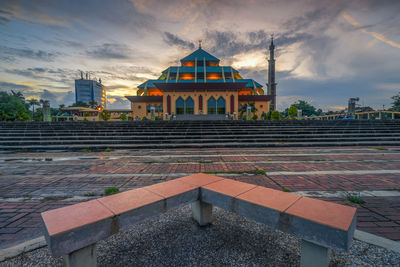 Building against sky during sunset in city