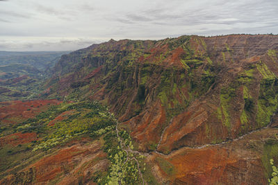 Scenic view of rocky mountains against sky helicopter view kauai