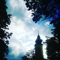 Low angle view of tower against cloudy sky