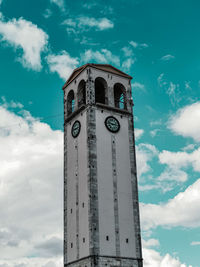 Low angle view of clock tower against sky