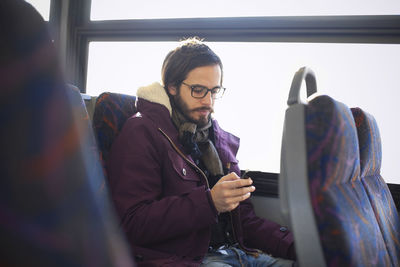 Mature man in bus, new jersey, usa
