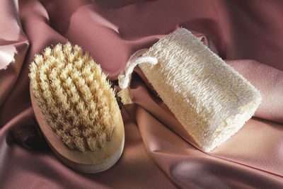 Natural washcloth and brush for dry massage. beauty, spa and wellness concept.