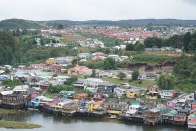 High angle view of townscape by river