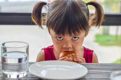 Portrait of cute boy eating food