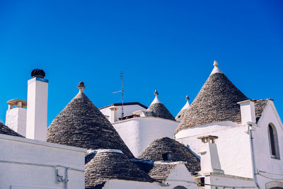 Low angle view of buildings against blue sky