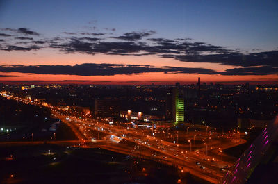 High angle view of illuminated city buildings at night