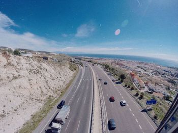 Cars on road against sky