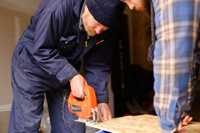 Rear view of men working