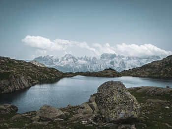 Scenic view of lake and mountains against sky