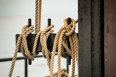 Close-up of rope tied to bollard