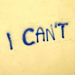 Close-up of text on wall