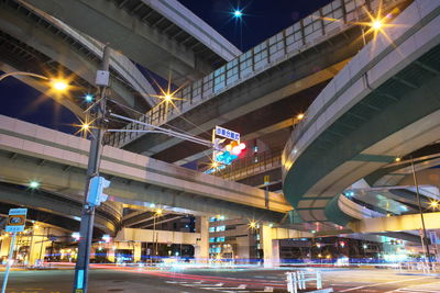 Low angle view of light trails on road at night