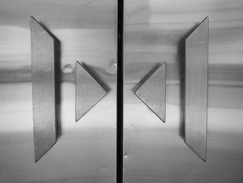 Close-up of arrow sign on table