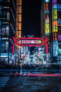 Illuminated city street at night