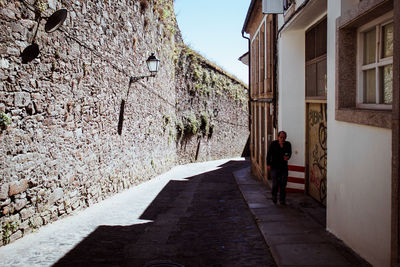 Rear view of woman walking on walkway