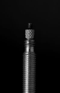 Close-up of electric lamp against black background