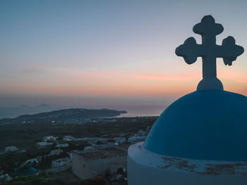 Scenic view of city and buildings against sky during sunset