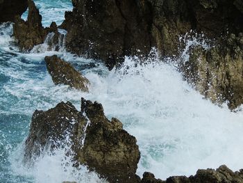 Waves splashing on rocks