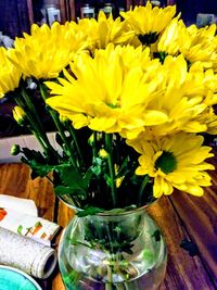 Close-up of yellow flowers in vase