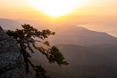 Scenic view of mountains against sky during sunset