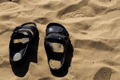 High angle view of shoes on sand