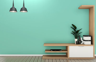 Empty chairs and table against wall at home