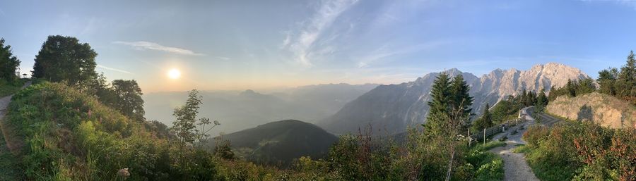 Panoramic view of trees and mountains against sky