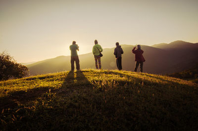 Rear view of people on mountain