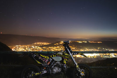 View of illuminated city against sky at night