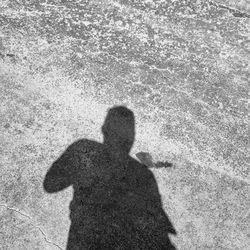 Shadow of person on shore