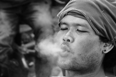 Close-up of man smoking