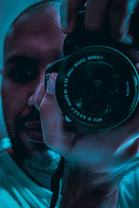 Close-up portrait of man photographing