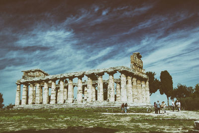 Group of people in front of historical building