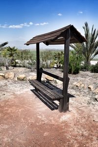 Gazebo on beach against sky