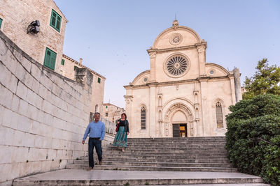 Low angle view of people outside building