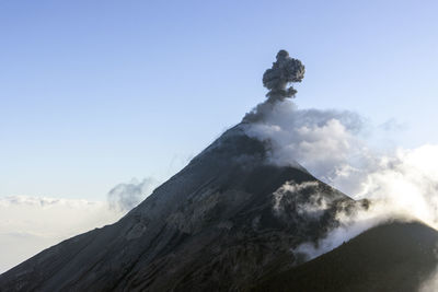 Scenic view of volcanic mountain against sky