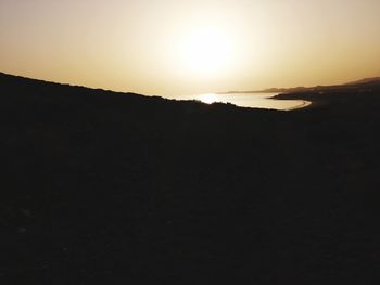 Scenic view of silhouette landscape against sky during sunset