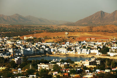 High angle view of residential district and mountains