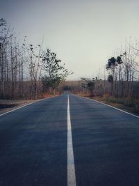 Empty road against clear sky 